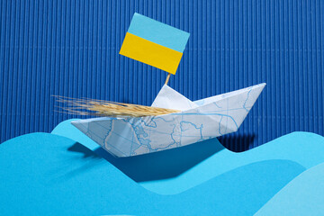 Concept of Ukrainian grain export with paper boat