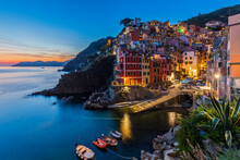 Italy, Liguria, Riomaggiore, Edge of coastal village alongCinqueTerreat dusk
