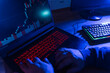 © Westend61 - Hands of hacker using illuminated keyboard at home