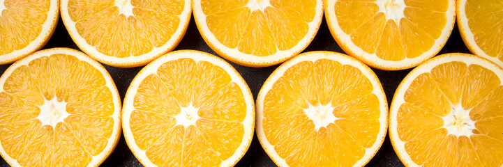 Poster - Half cut oranges on an old wooden table