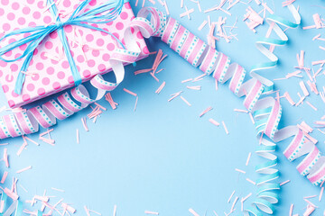 Poster - Birthday background with pink dotted gift box, serpentine and confetti on blue background