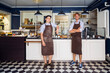 © Astrakan Images - Portrait of young owners in bakery