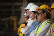 © sittinan - engineer team standing at industry