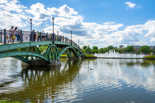 Tsaritsynsky Park In Moscow On A Sunny Summer Day. View Of The River With Reflection And Bridge. Tsaritsynsky Park Is One Of The Main Tourist Attractions In Moscow.