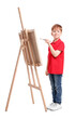 © New Africa - Little boy painting against white background. Using easel to hold canvas