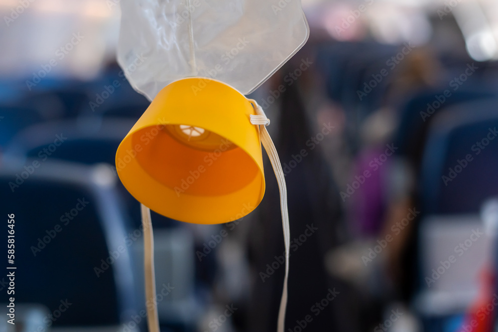 O2 Mask Free Fall oxygen mask drop from the ceiling compartment on airplane.. Stock Photo ...