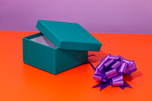 Carton Box Near Bright Purple Gift Bow