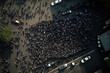 © Lazy_Bear - Protesting crowd at city street. Protesting people marching at city, aerial view. Social problems in society, struggle for rights. Protest activists. Crowd with raising fists and banners. Created with
