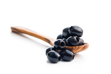 Wall Mural - Pitted black olives in spoon isolated on white background.