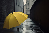 Fototapeta Do przedpokoju -  a yellow umbrella sitting on the side of a street next to a building on a rainy day in the rain with no umbrellas on the ground.  generative ai