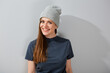 © Yuriy Shevtsov - Smiling young woman in teenage style and beanie hat. Woman portrait.