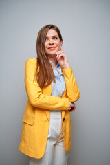 Wall Mural - Woman in yellow jacket looking away. Isolated female portrait.