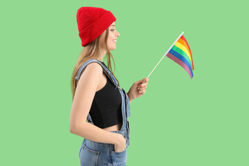 Poster - Beautiful young woman with LGBT flag on green background