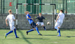 © JackF - Youthful football players challenging for ball in midfield zone
