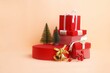 Studio shot of red gift boxes, Christmas trees and golden bells for a background usage