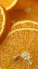 Sticker - Vertical footage of juicy freshly sliced oranges