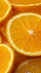 Canvas Print - Vertical footage of juicy freshly sliced oranges