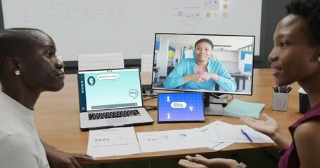 Poster - Diverse business people having video call and using laptop with digital chat on screen in office