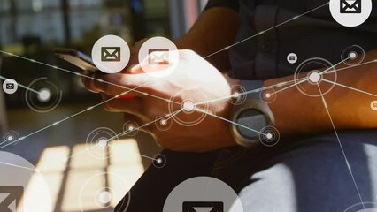 Animation of message icons and network of connections over mid section of man using smartphone