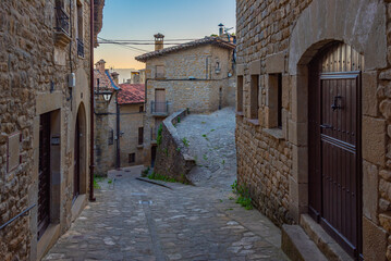 Wall Mural - Sunrise view of a Medieval street in Spanish village Sos del Rey Catolico