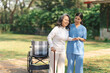 © NanSan - Young asian care helper with asia elderly woman on wheelchair relax together park outdoors to help and encourage and rest your mind. using crutches and cane help support yourself to walk