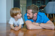 © Danko - Parents and children being friends. Joyful father and son having fun, dad lying on floor. spending tim at home together. Single dad concept.