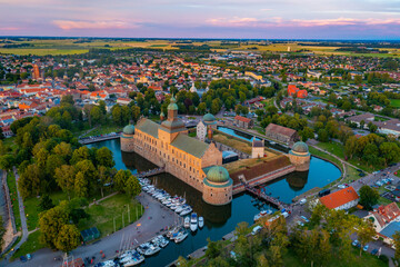 Wall Mural - Sunset aerial view of Swedish town Vadstena and its castle