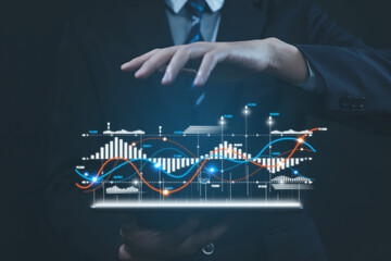 Businessman planning digital stock market analysis strategy Technology chart showing positive growth. investment finance	