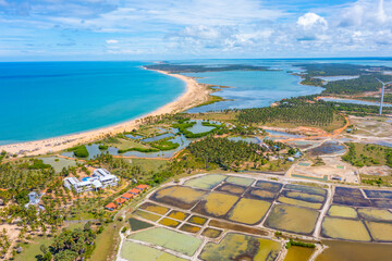 Canvas Print - Aerial view of agricultural fields overlooked by wind power turbines at Kalpitiya in Sri Lanka