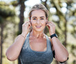 © Phindulo T/peopleimages.com - Fitness, woman and portrait smile with music earphones for exercise, workout or listening in nature. Happy and fit female smiling for audio track, streaming or sound for training or running outdoors