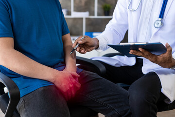 male patient sitting and consulting a doctor Prostate cancer problem Std Caucasian Man with his hand holding his crotch prostate inflammation erection problems