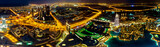 Fototapeta Sport - Night panoramic view of Dubai city in UAE