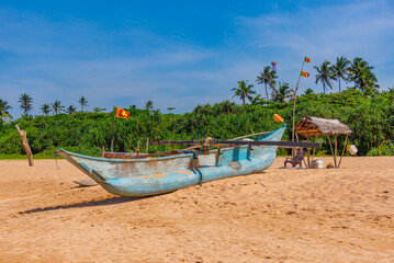 Canvas Print - Fishing boat on a beach at Bentota, Sri Lanka