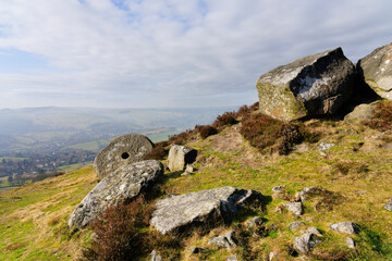 Wall Mural - Lichen covered boulders and abandoned mill stones on Curbar Edge.