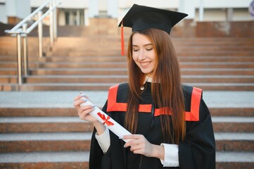 Wall Mural - Woman portrait on her graduation day. University. Education, graduation and people concept.