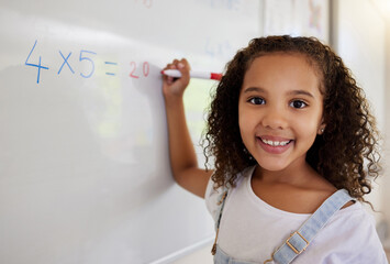 Poster - Whiteboard, math and portrait of girl learning, studying and education in classroom. Development, mathematics and face of happy kid or student with equations, numbers and multiplication in school.