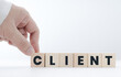 © Isara - businessman putting wooden blocks showing customer letters