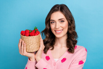 Photo portrait of attractive woman hold strawberry market shopping wear trendy pink print outfit isolated on blue color background