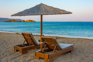 Canvas Print - Sunset view of parasols and sunbeds at Vai beach at Crete, Greece