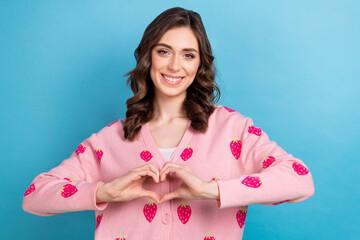 Sticker - Portrait photo of adorable young woman wear pink strawberry print cardigan show sympathy symbol love story isolated on blue color background