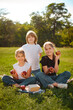 © cenchild - group portrait of happy children looking at camera and playing in park after school classes