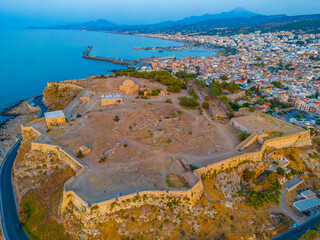 Wall Mural - Sunset aerial view of Venetian Fortezza Castle in Greek town Rethimno, Crete