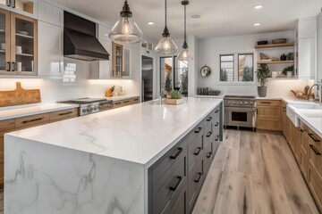 Wall Mural - Beautiful kitchen in new luxury home with waterfall island, quartz counter tops, farmhouse sink, and hardwood floors. 