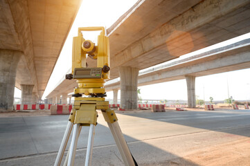 theodolite on construction site Surveyor Engineer uses theodolite to mark coordinated concrete piles on construction site.