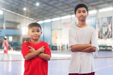 portrait boys playing football at indoor