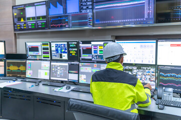 Engineer working at control room,Manager control system,Technician man monitoring program from a lot of monitor