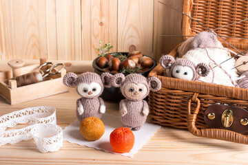 knitted brown Russian toy cheburashka with oranges. Handmade by hand made