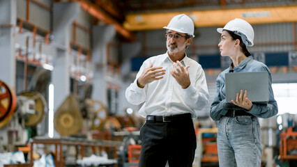 portrait of female engineer team standing and working in industrial factory. professional engineerin