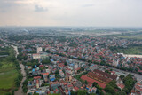 Fototapeta Morze - Aerial view of residential neighborhood roofs. Urban housing development from above. Top view. Real estate in Hanoi City, Vietnam. Property real estate.