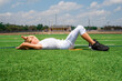 © 3Days2Go Media - Young preteen football player boy exhausted or injured on sunny football field